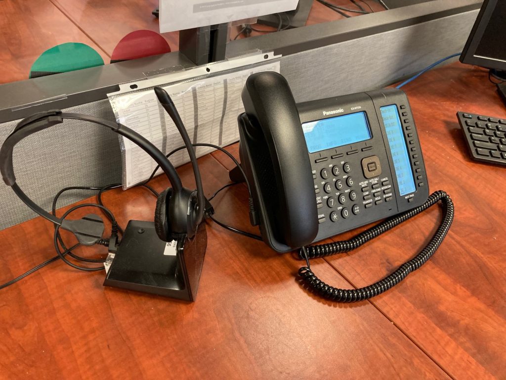 Office desk with telephone and headset