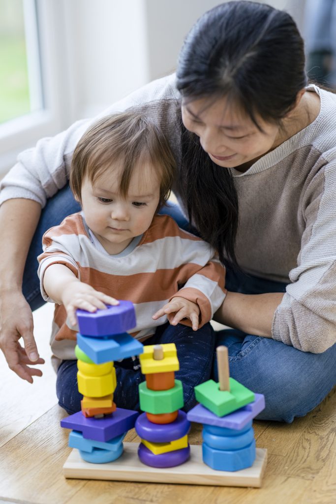 A mother playing with her little child