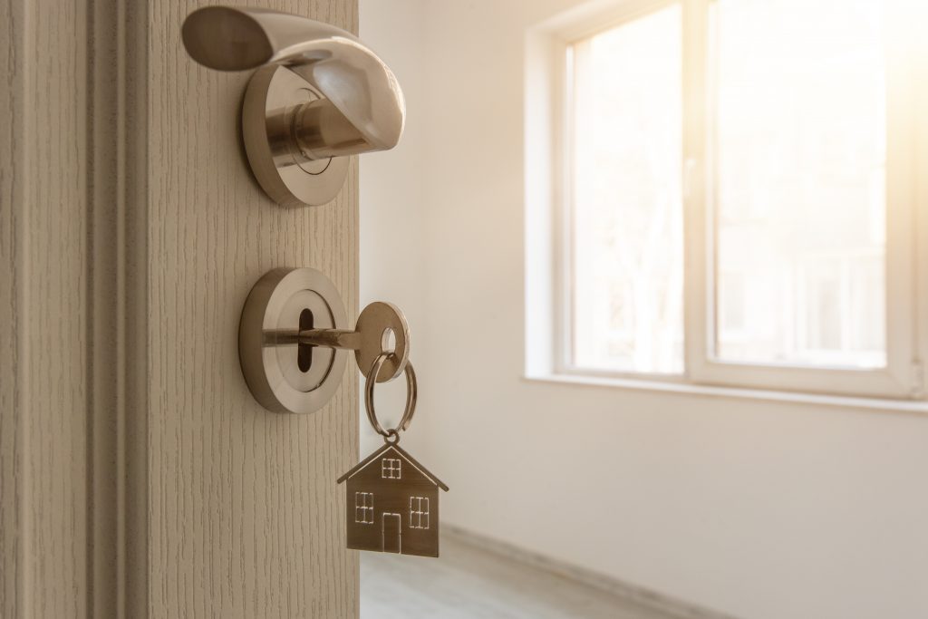 Door opening with a key inserted in the keyhole