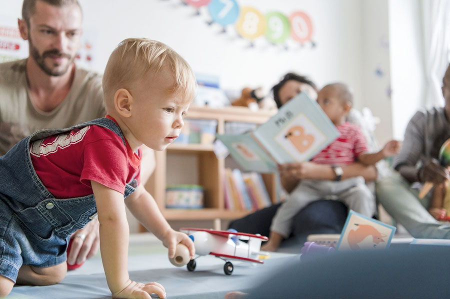 Little boy playing in a classroom