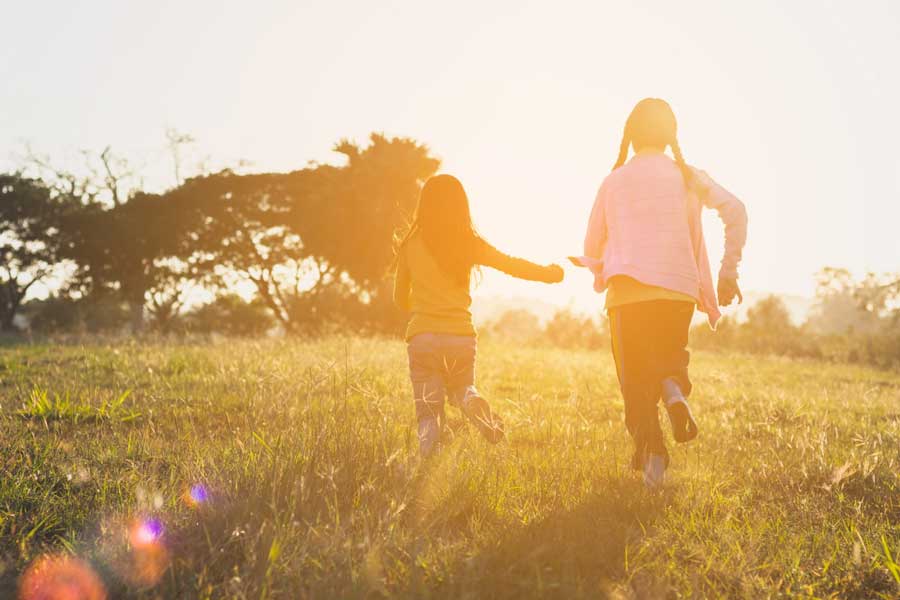 Childrens playing in an open field